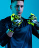 Person wearing Kaliaaer Ignite yellow Goalkeeper Gloves